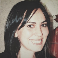 Dark-haired woman smiling